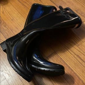 Woman’s Tall Hunter Rain boots.